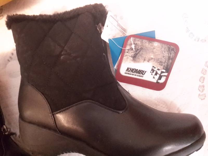 lot 91 image: 3 pair of womens, size 8 boots.. 2 pair look to have never been worn.  One pair is Khombu.. One pair is Toggle.  The other pair of boots is almost like new