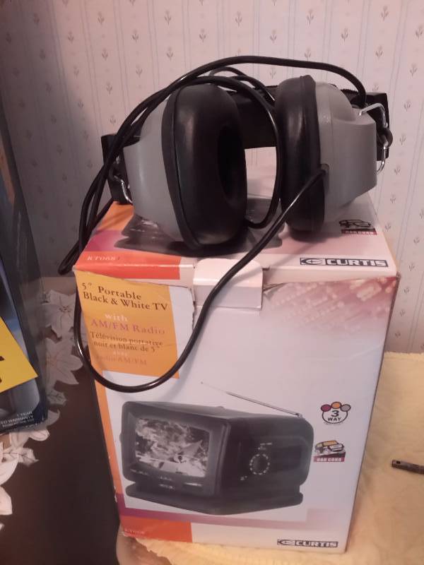 lot 94 image: Misc. electronics.. 5 in tv, Fan, Head Set.. None tested