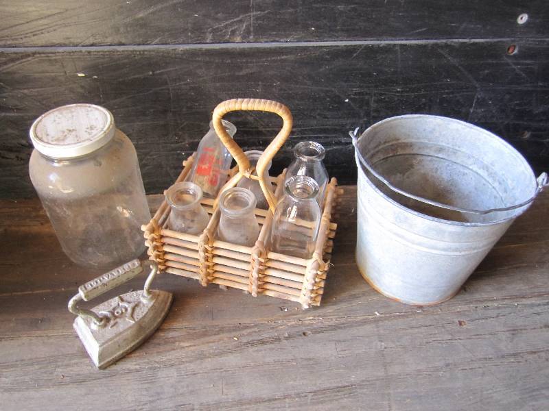 lot 23 image: Vintage milk bottles, metal pail an...