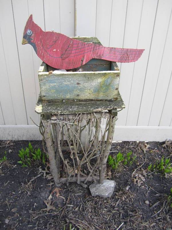 lot 91 image: Wood stand with cardinal on top...