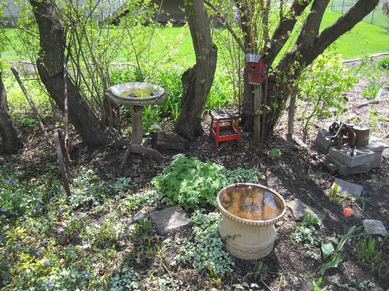 lot 121 image: Decorative tiller, bird baths, trac...