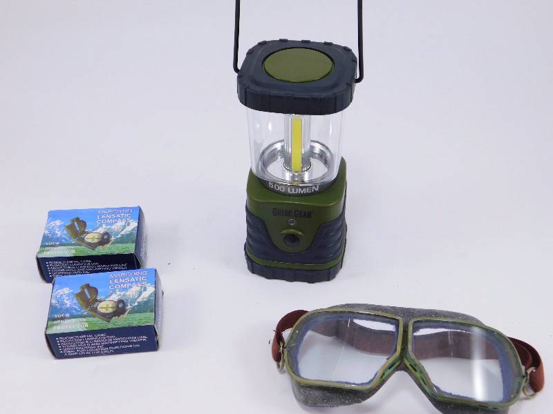 lot 78 image: Russian Military Surplus 50s Era Tanker Goggles, Guide Gear COB LED Lantern, 500 Lumen, Military-Style Lensatic Compasses, 2 Pack
