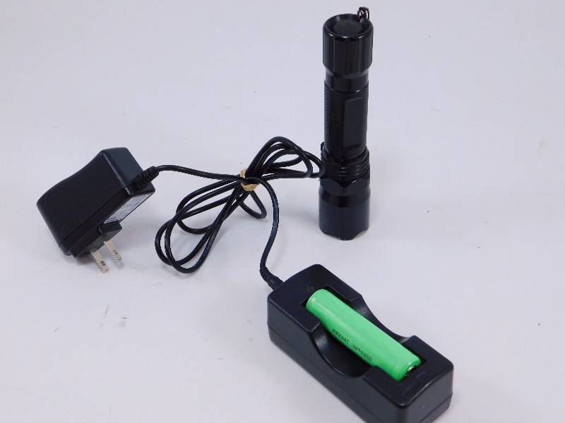 lot 110 image: Rechargeable 240 - lumen Tactical Light