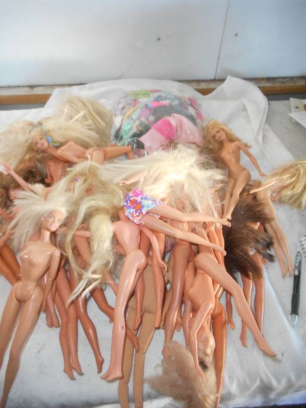 lot 41 image: ABOUT 30 COLLECTIBLE BARBIES