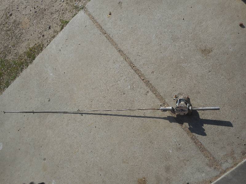 lot 50 image: ANTIQUE STEEL FISHING ROD AND REEL