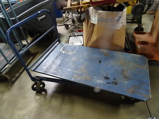 All metal 4 wheel warehouse cart. 3...