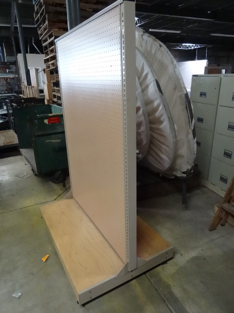 Double sided retail display on whee...