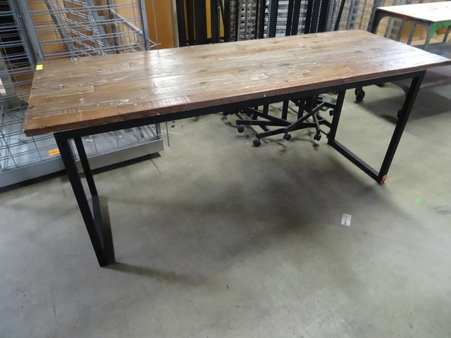 Metal framed table with wood top. 8...