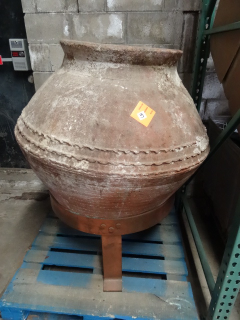 Ancient pottery pot with solid copp...