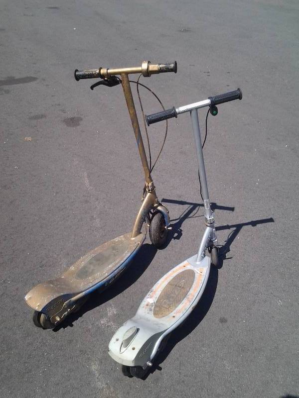 lot 6 image: 2-Razor Electric Scooters For Parts Or Repair