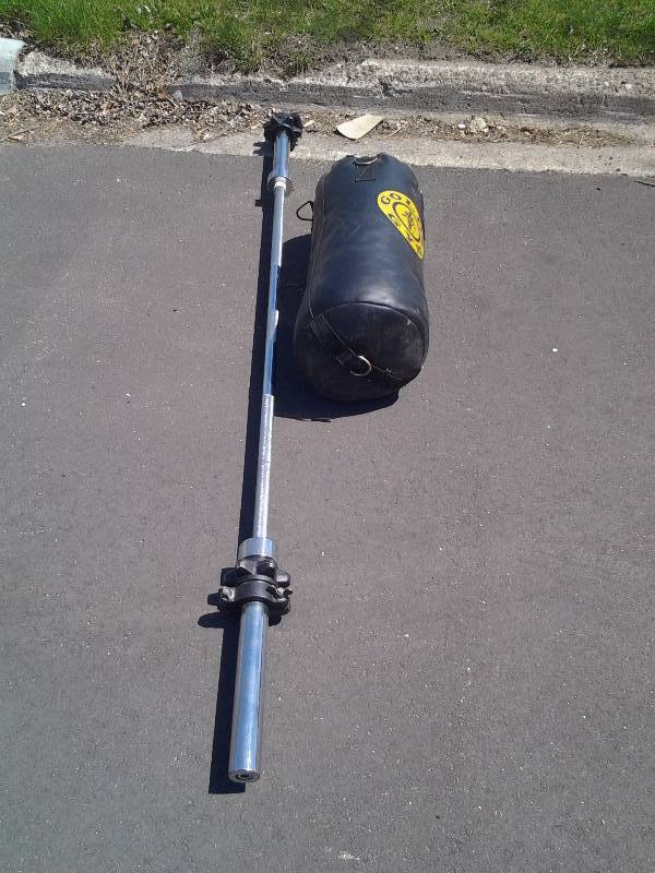lot 12 image: Golds Gym Punching Bag & Olympic Size Bar