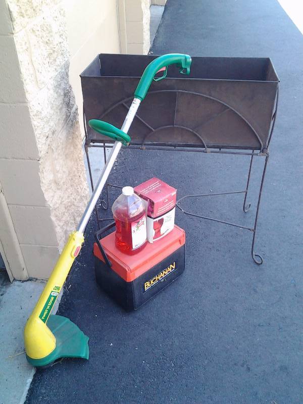 lot 21 image: Metal Planter, Electric Weed Eater, Cooler, Humming Bird Feeder & Nectar