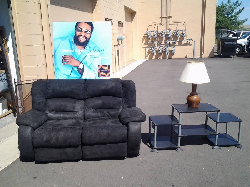 lot 34 image: Reclining Love Seat, 3 Tier Entertainment Stand, Lamp & Large Poster