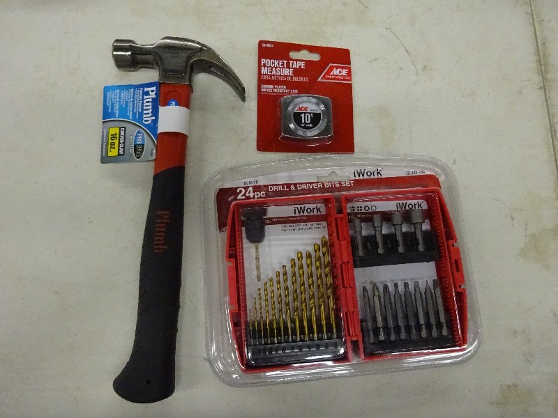 lot 34 image: Plumb hammer 16 oz. pocket tape measure, 24 pc drill and driver buts set