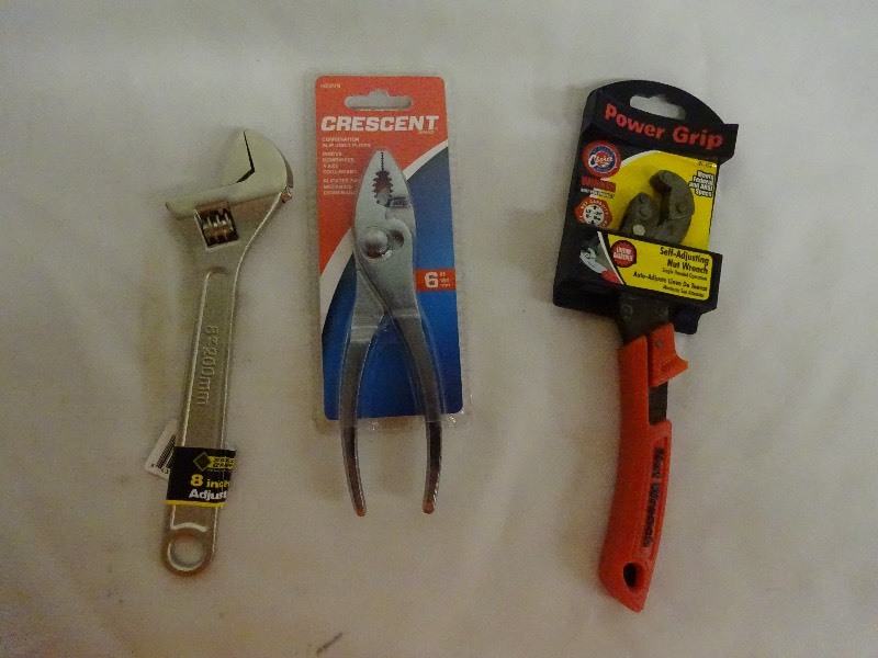 lot 86 image: 8 adjustable wrench, crescent 6 slip joint pliers, power grip self adjusting nut wrench