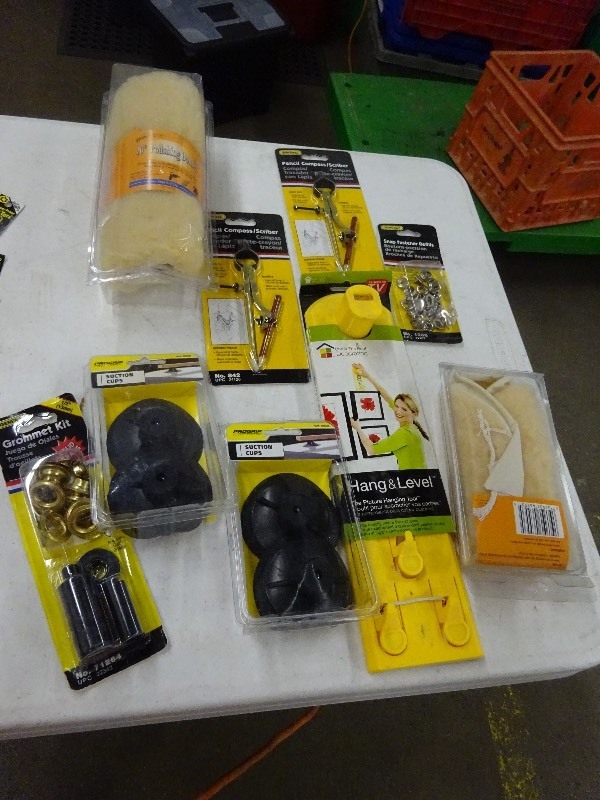 lot 110 image: Suction cups, grommet key, polishing pads, pencil compass, picture, hanging tool