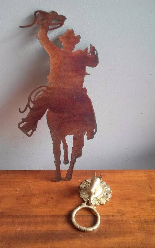lot 99 image: Metal Cowboy Wall Dcor, 18 and Brass Horsehead Hanger, 7
