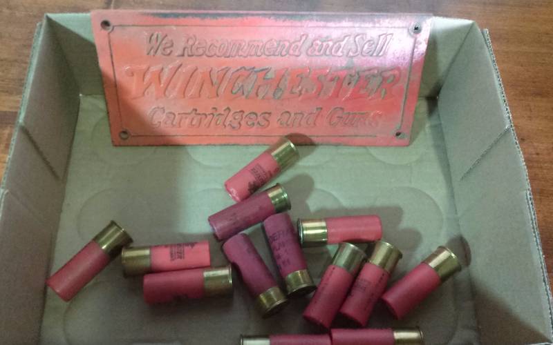 lot 214 image: Heavy Metal WINCHESTER Plaque and 12 gauge Ammo