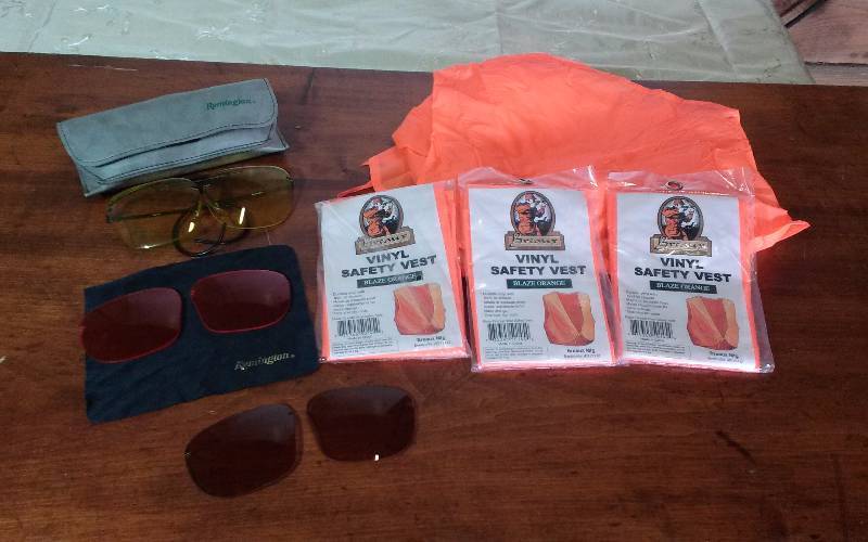 lot 215 image: Lot - Remington Skeet Trap Glasses & Safety Vests