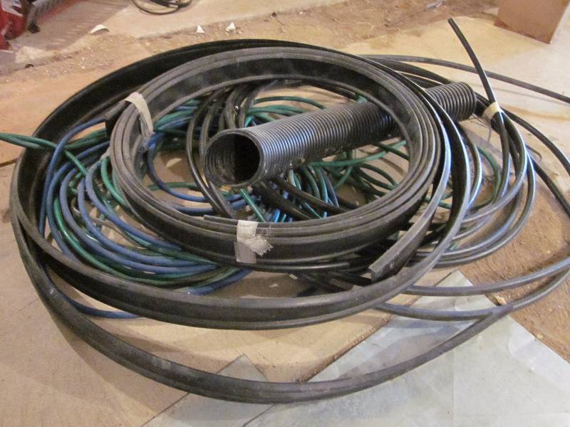 lot 63 image: Garden Hoses, Landscape Edging, & Plastic Water Pipe