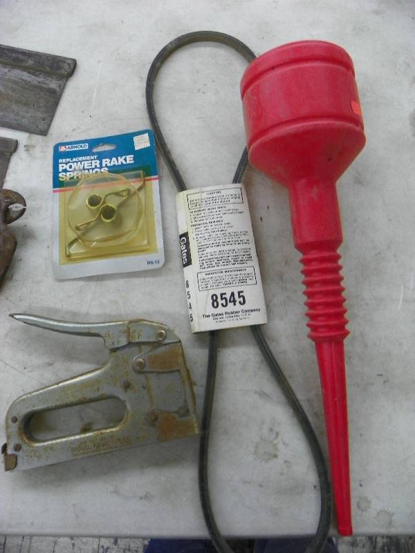 lot 254 image: Saws, stapler, funnel, belt, hand drill and misc
