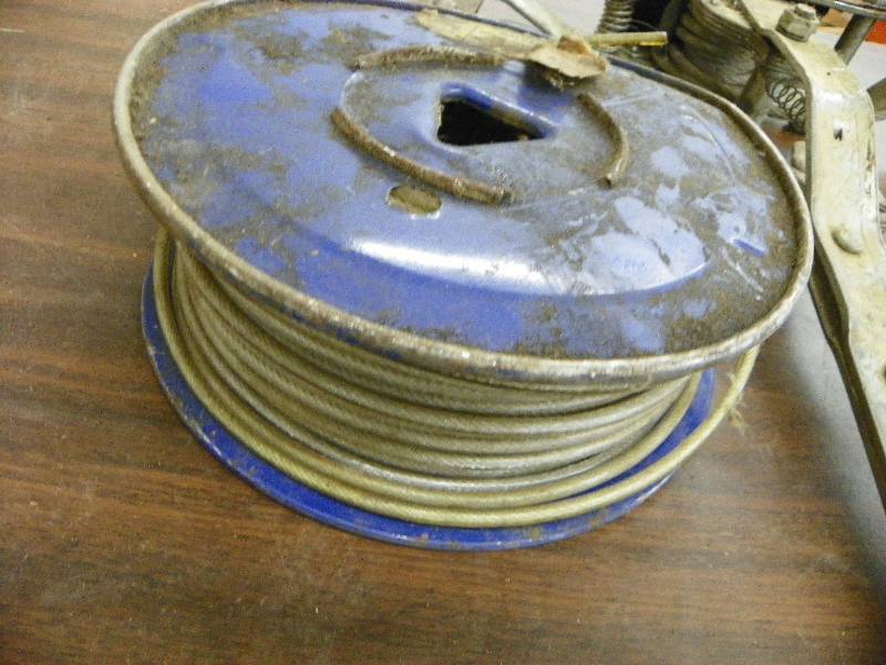 lot 564 image: Come-a-long and spool of cable