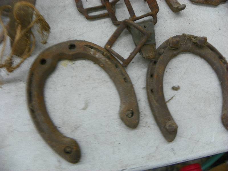 lot 586 image: Horse shoes, buckles