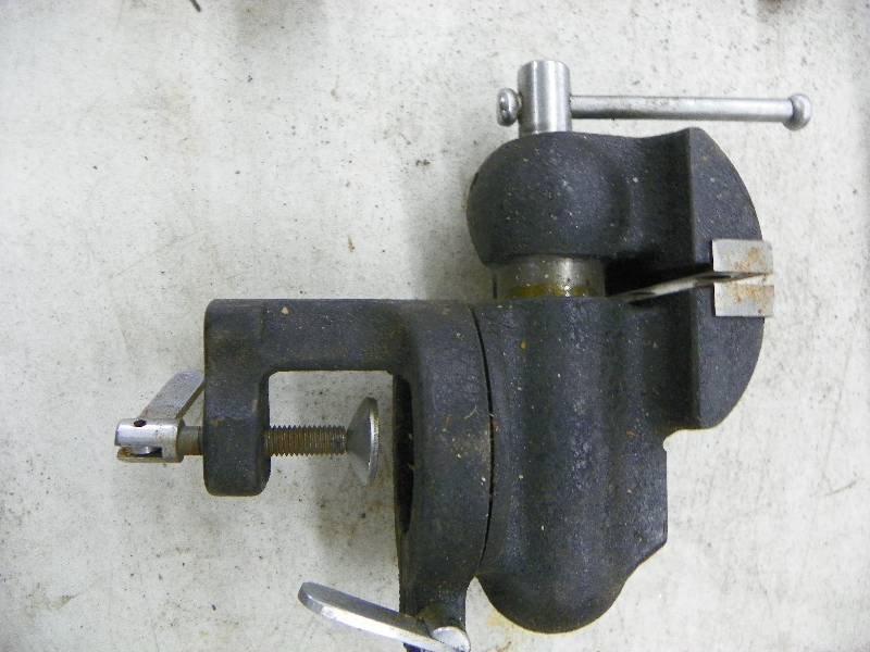 lot 587 image: Swivel base vice and clamps