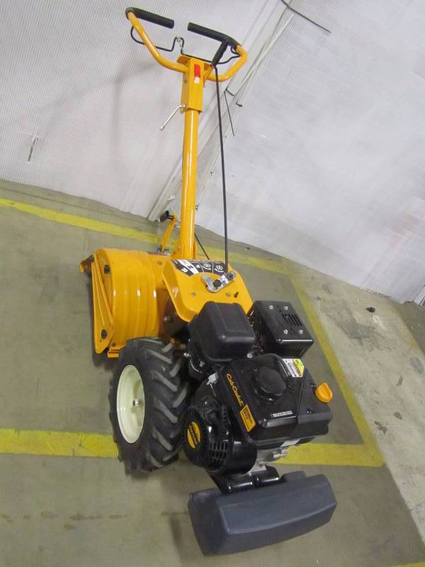 lot 4 image: Cub Cadet 18 208 cc rear tine dual direction gas tiller.
