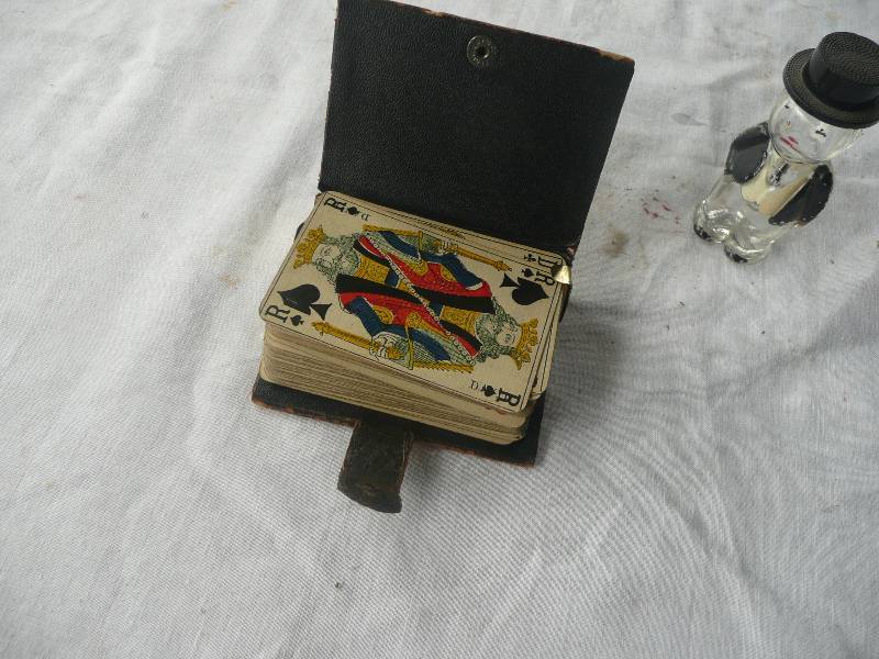 lot 37 image: Antique Leather Card Case WCards & Vintage Figure - Very Cool - See Pictures