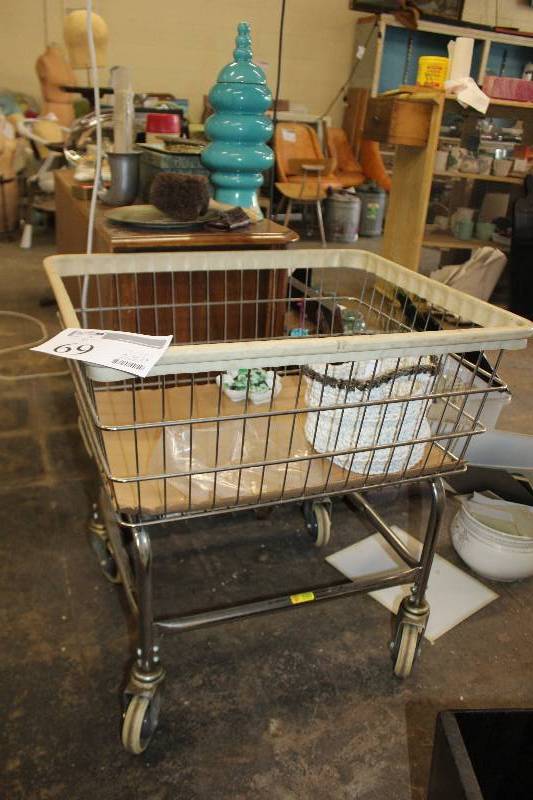 lot 69 image: Industrial rolling laundry bin. Casters roll smooth.