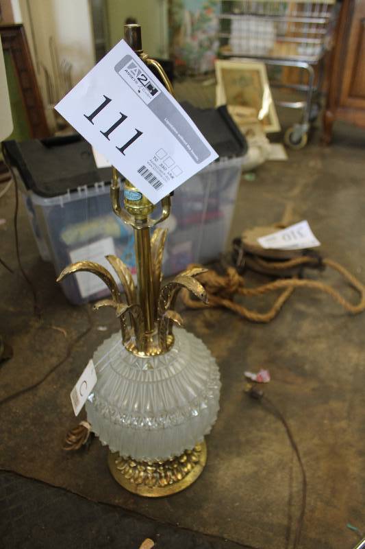 lot 111 image: Glass pineapple and brass table lamp.
