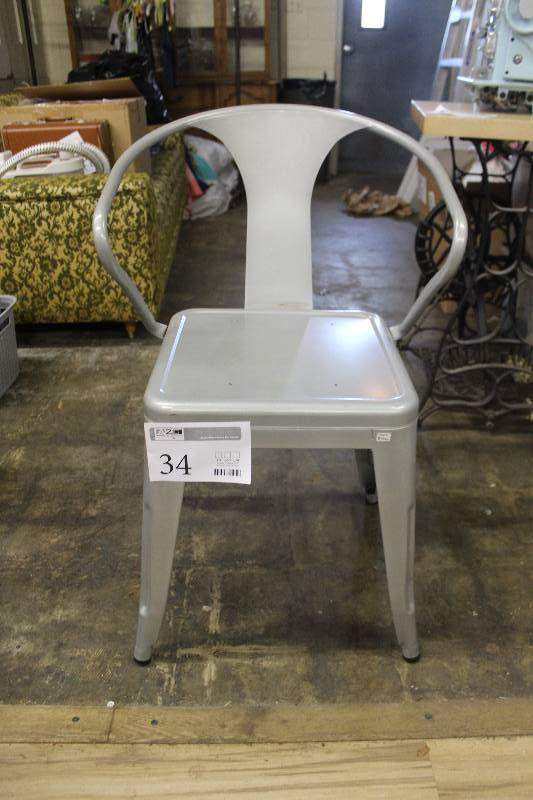 lot 34 image: Reproduction Tolix arm chair in silver.
