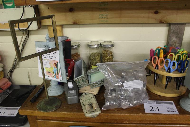 lot 23 image: Stack of vintage postcards. Clipboard stands. Decorative scissors. Vintage sign stand. Vintage paper clip holder. Ball jars.