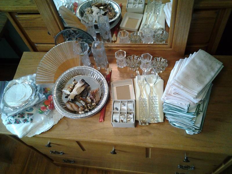 lot 144 image: Linens, Napkins, Napkin Rings, Crystal Bud Vases, Tooth Picks, Servers, Hand Fan, Misc Bring Boxes
