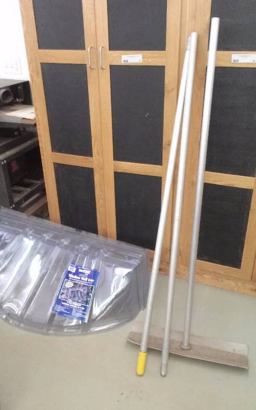 lot 47 image: Lot - (4) NEW Window Well Covers & Roof Rake