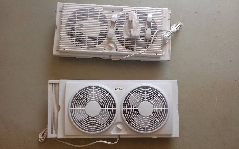 lot 49 image: Lot - (2) Twin Window Fans, New
