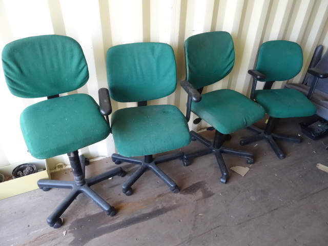 3 office chairs on wheels.