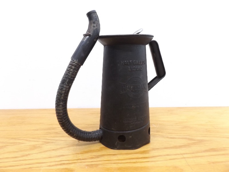 lot 22 image: Antique Metal Huffman Half Gallon Oil Can