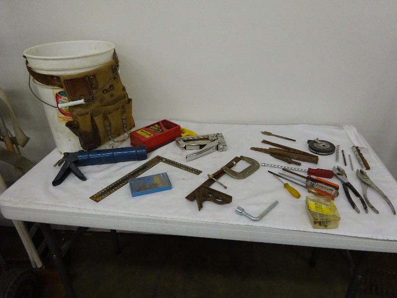 lot 22 image: Variety of tools and bolts and bucket with tool holder