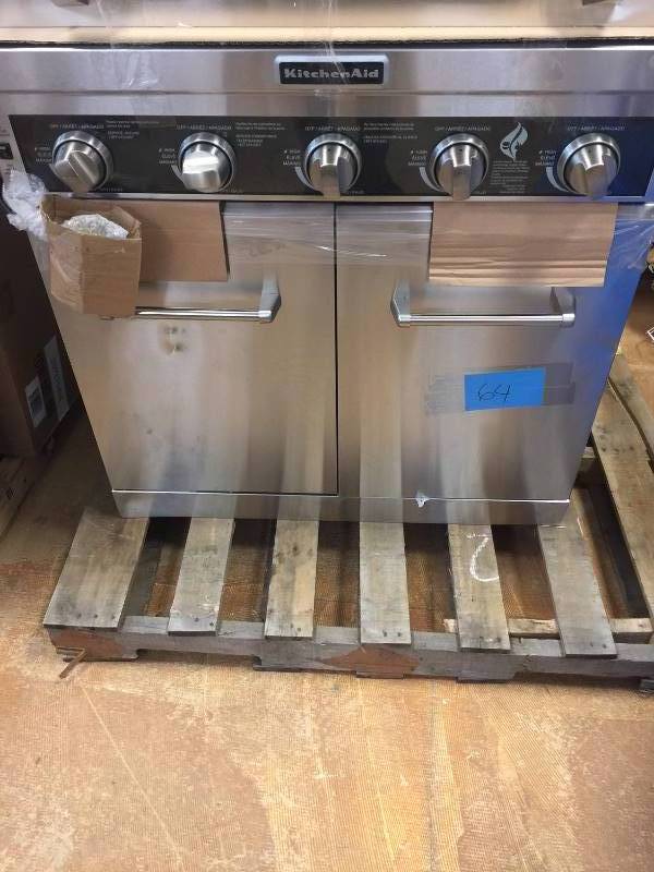 lot 64 image: KitchenAid  5-Burner Propane Gas Grill in Stainless Steel with Sear and Side Burners  never used dented on the side and on the top Model # 720-0893