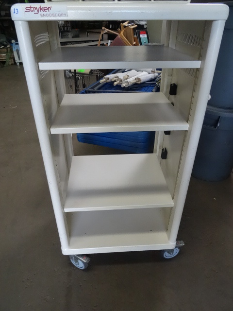 Metal storage cabinet on wheels. 3 ...