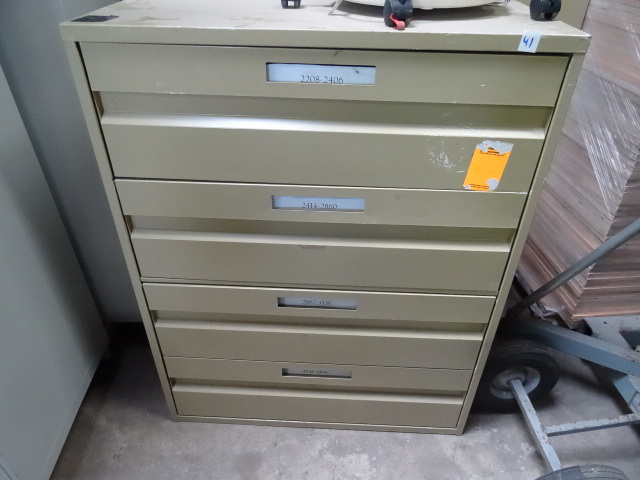 4 drawer metal cabinet. Has divider...