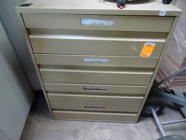 4 drawer metal cabinet. Has divider...