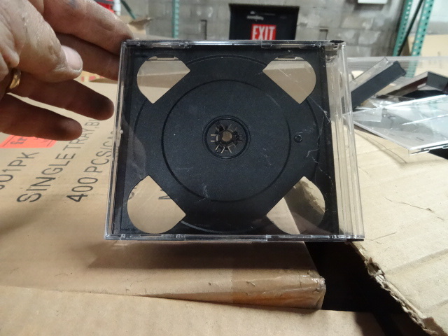 Pallet of DVD and CD cases. All dif...