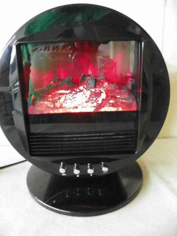 lot 24 image: Oscillating Fireplace Heater