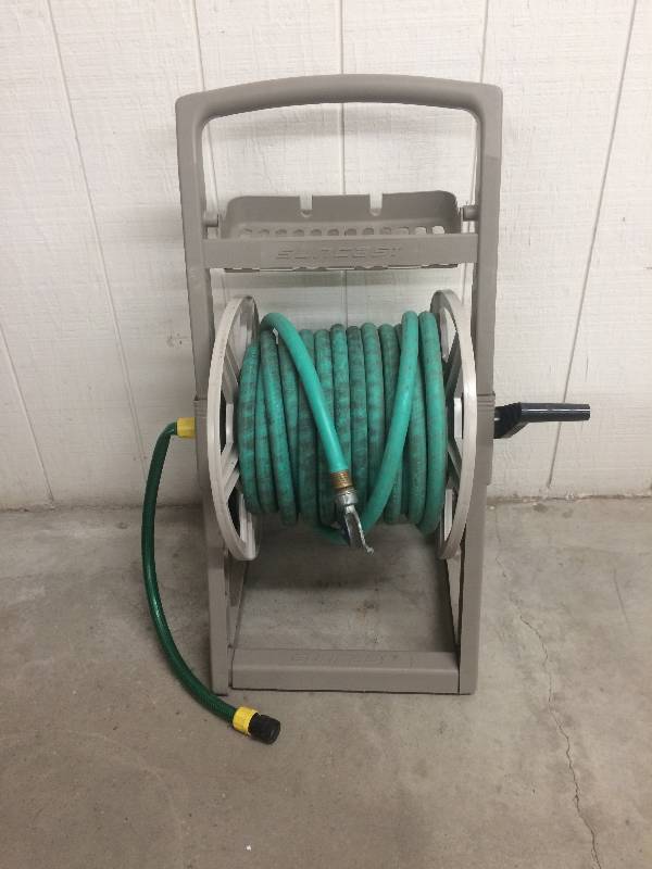 lot 49 image: Garden Hose and Reel