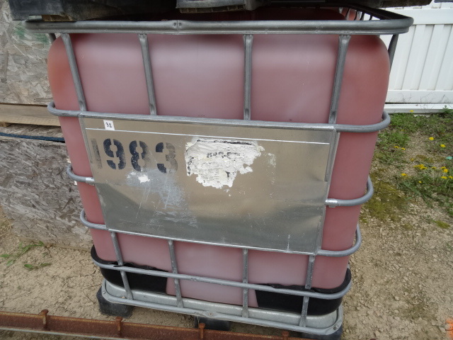 250 gal liquid tote. Metal framed c...