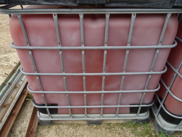 250 gal liquid tote. Metal framed c...