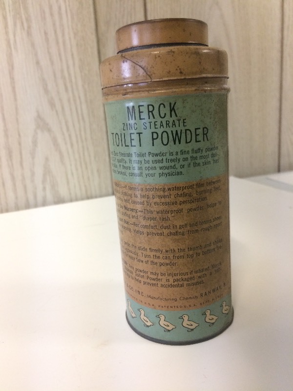 lot 34 image: Vintage MERCK TOILET POWDER tin